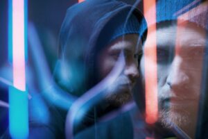 blurred motion of man in hoody 2SXEAVR scaled 1